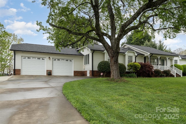 106 S Oakwood Dr, Kings Mountain, NC 28086 - ranch-style home featuring a front lawn, concrete driveway, an attached garage, a porch, and roof with shingles