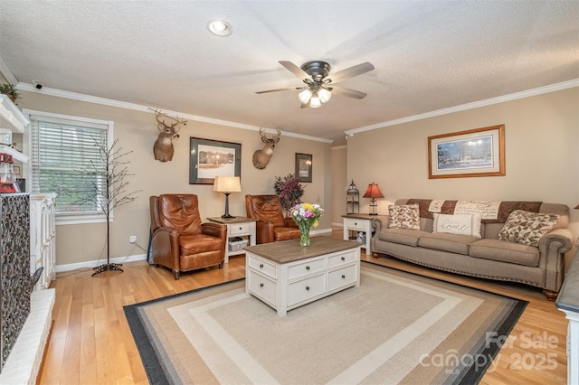 106 S Oakwood Dr, Kings Mountain, NC 28086 - living area featuring light wood finished floors, crown molding, baseboards, a textured ceiling, and ceiling fan