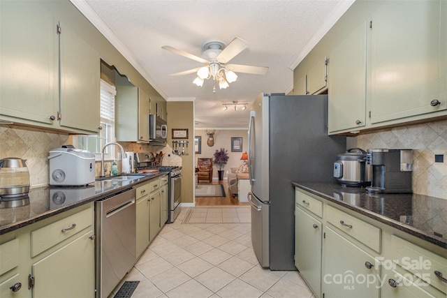 106 S Oakwood Dr, Kings Mountain, NC 28086 - kitchen featuring a ceiling fan, crown molding, a sink, light tile patterned floors, and appliances with stainless steel finishes