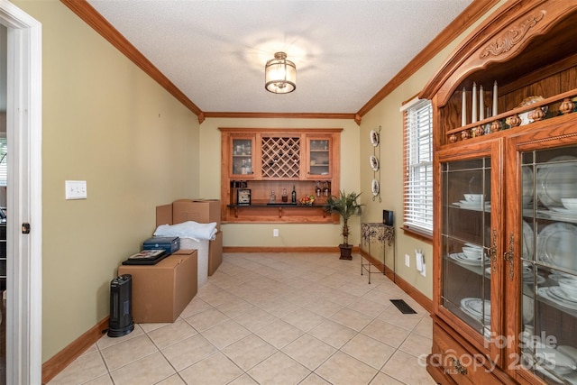 106 S Oakwood Dr, Kings Mountain, NC 28086 - interior space with visible vents, a bar, light tile patterned floors, crown molding, and a textured ceiling