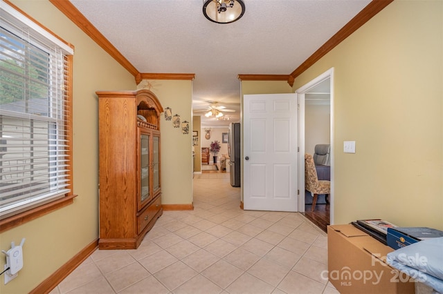 106 S Oakwood Dr, Kings Mountain, NC 28086 - hallway featuring a textured ceiling, baseboards, ornamental molding, and light tile patterned floors