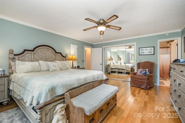 106 S Oakwood Dr, Kings Mountain, NC 28086 - bedroom with light wood-style flooring, a textured ceiling, crown molding, and a ceiling fan