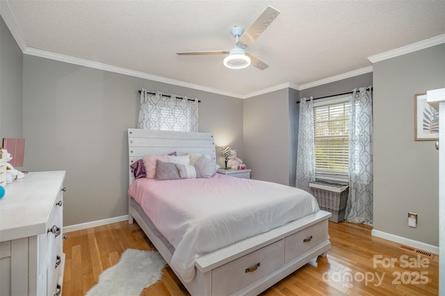 106 S Oakwood Dr, Kings Mountain, NC 28086 - bedroom with baseboards, crown molding, light wood-style floors, and visible vents