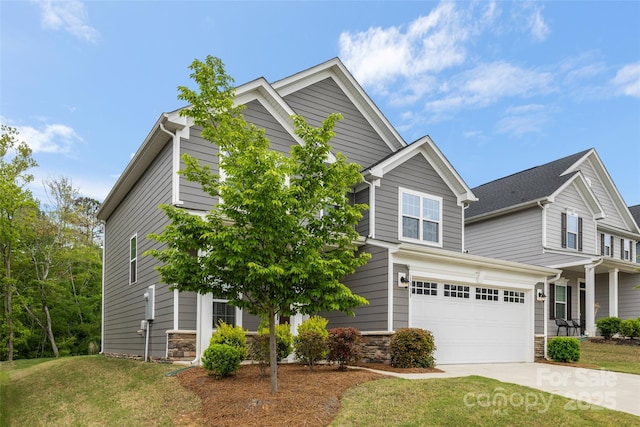 1933 Tin Roof Ln, Monroe, NC 28112 - craftsman inspired home featuring a front lawn, concrete driveway, an attached garage, and stone siding
