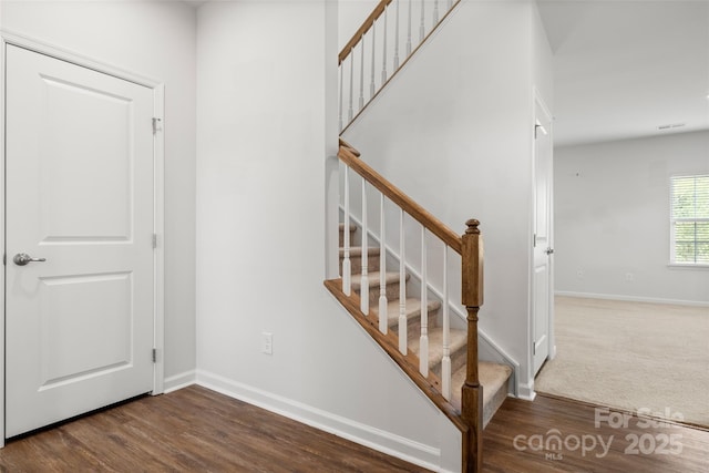 1933 Tin Roof Ln, Monroe, NC 28112 - stairway with baseboards and wood finished floors