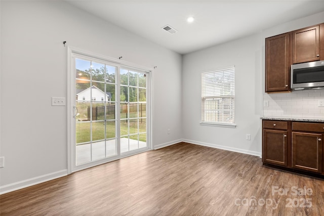 1933 Tin Roof Ln, Monroe, NC 28112 - interior space featuring visible vents, baseboards, and light wood-type flooring