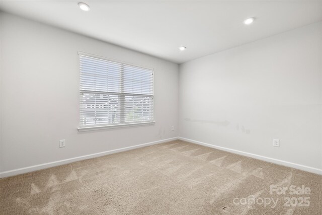 1933 Tin Roof Ln, Monroe, NC 28112 - carpeted empty room featuring baseboards and recessed lighting