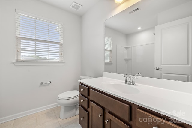 1933 Tin Roof Ln, Monroe, NC 28112 - full bath with visible vents, a healthy amount of sunlight, toilet, and tile patterned flooring