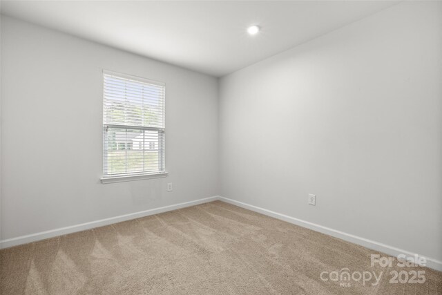 1933 Tin Roof Ln, Monroe, NC 28112 - spare room featuring recessed lighting, carpet floors, and baseboards