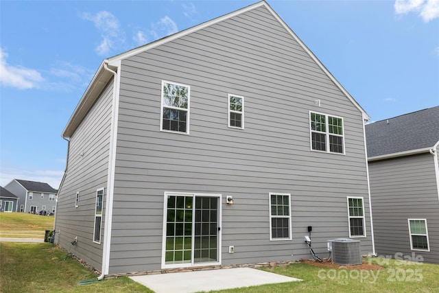 1933 Tin Roof Ln, Monroe, NC 28112 - back of house with a lawn, cooling unit, and a patio