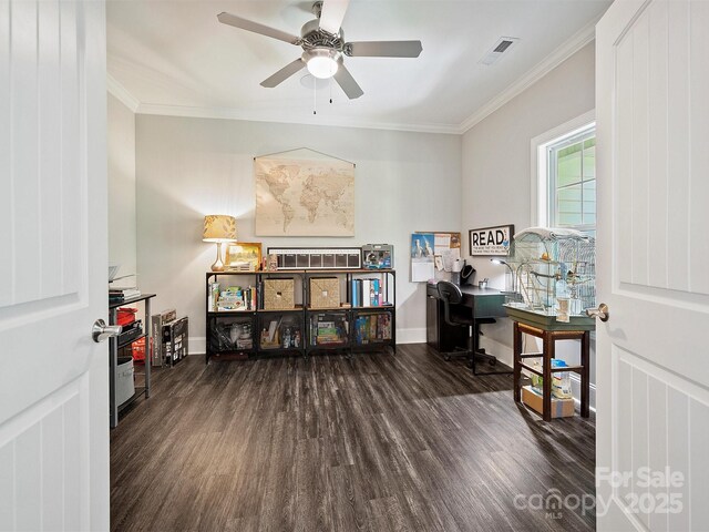 home office with baseboards, crown molding, wood finished floors, and visible vents