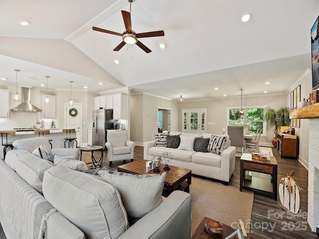 living area featuring recessed lighting, vaulted ceiling, ornamental molding, baseboards, and ceiling fan