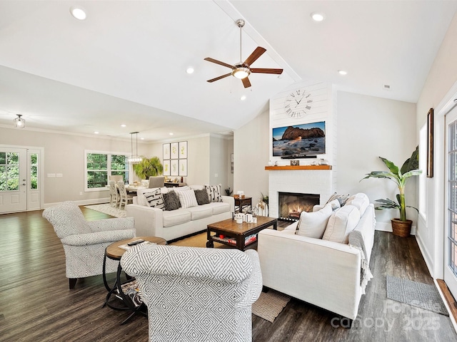 living room with dark wood-type flooring, beamed ceiling, baseboards, a brick fireplace, and ceiling fan