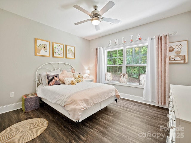 bedroom featuring baseboards, a ceiling fan, and wood finished floors