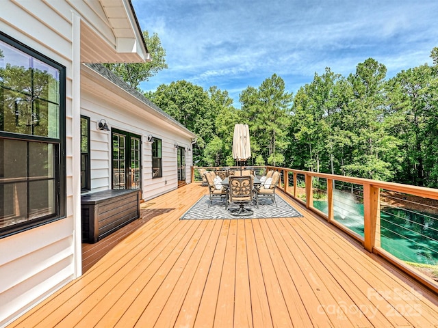 wooden deck with outdoor dining space