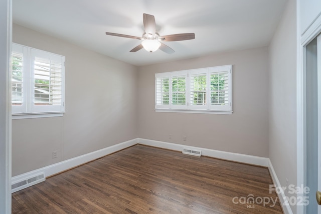 4920 Raymond Pl, Charlotte, NC 28205 - unfurnished room featuring wood finished floors, baseboards, and ceiling fan