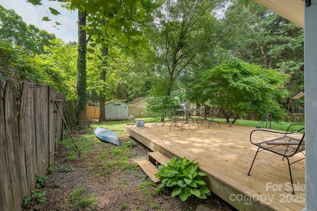 4920 Raymond Pl, Charlotte, NC 28205 - wooden terrace with a fenced backyard and outdoor dining area