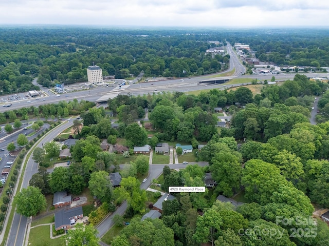 4920 Raymond Pl, Charlotte, NC 28205 - drone / aerial view of a heavily wooded area and a highway