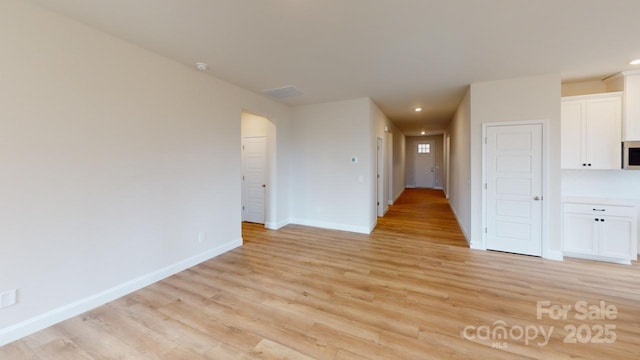 606 Banter Ln Unit 30, Cramerton, NC 28032 - spare room featuring light wood-style floors and recessed lighting