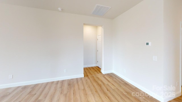 606 Banter Ln Unit 30, Cramerton, NC 28032 - empty room with light wood-style floors and a smoke detector