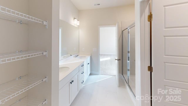 606 Banter Ln Unit 30, Cramerton, NC 28032 - bathroom with double vanity, a shower stall, and marble finish floors