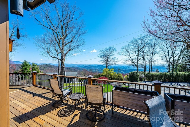 wooden terrace with a mountain view
