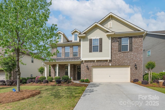 craftsman inspired home featuring a garage, a front lawn, brick siding, and concrete driveway