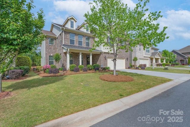 view of front of property with brick siding, a front yard, a garage, and concrete driveway