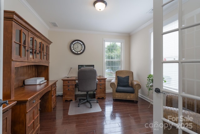 office space featuring dark wood finished floors, baseboards, crown molding, and visible vents