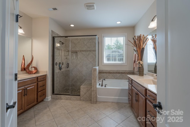 bathroom featuring a shower stall, tile patterned flooring, visible vents, vanity, and a bath
