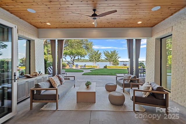 7861 Live Oaks Dr, Denver, NC 28037 - sunroom / solarium featuring a water view, wooden ceiling, brick wall, recessed lighting, and wood finished floors