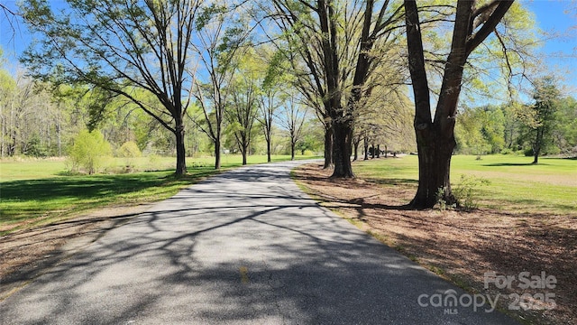 3190 Holly Rd, Connelly Springs, NC 28612 - view of community featuring asphalt driveway and a lawn
