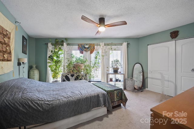 3190 Holly Rd, Connelly Springs, NC 28612 - bedroom with carpet floors, a closet, ceiling fan, and a textured ceiling