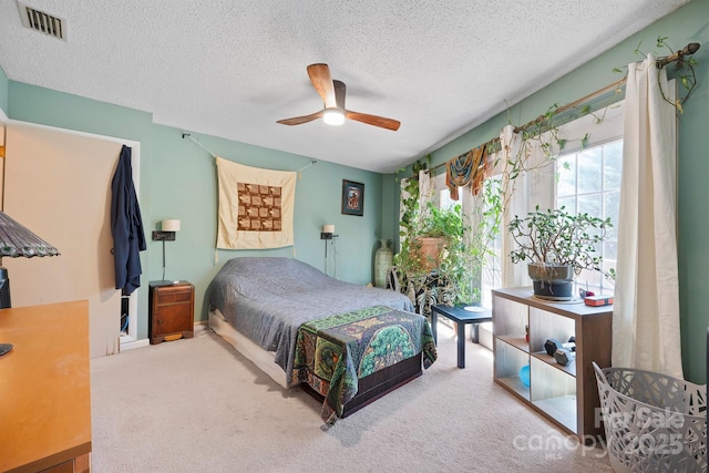 3190 Holly Rd, Connelly Springs, NC 28612 - bedroom featuring carpet flooring, a textured ceiling, and a ceiling fan