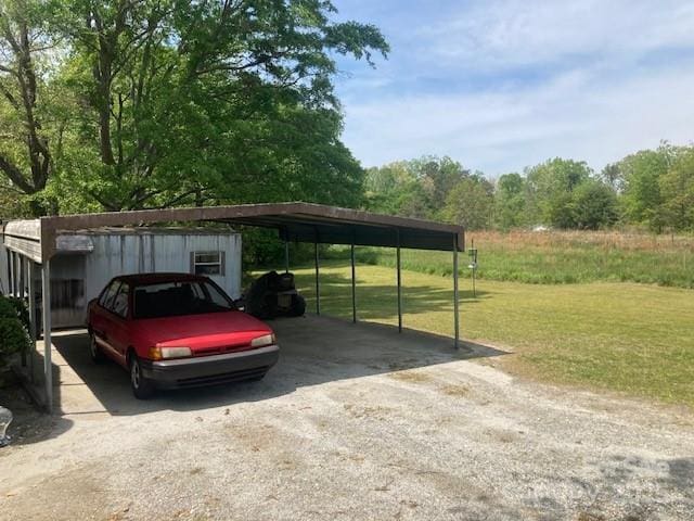 314 Phillips Dr, Forest City, NC 28043 - view of vehicle parking with a carport and driveway