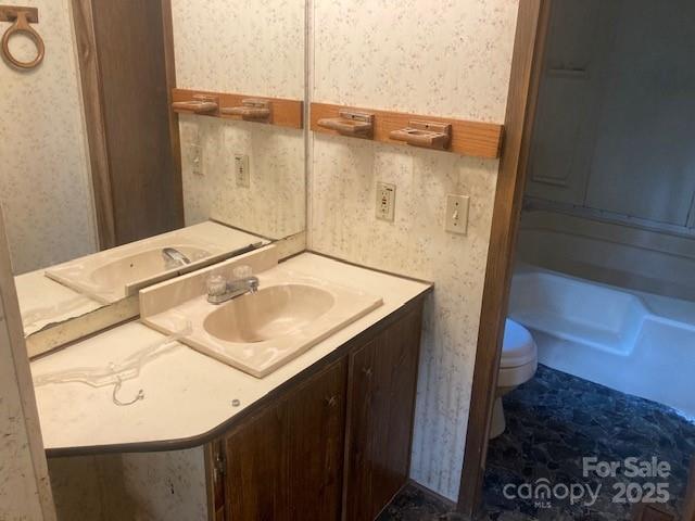 314 Phillips Dr, Forest City, NC 28043 - bathroom featuring toilet and vanity