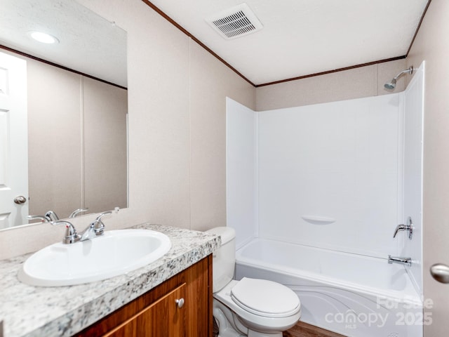 bathroom featuring bathtub / shower combination, ornamental molding, toilet, vanity, and visible vents