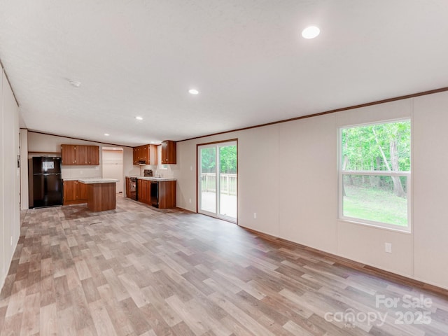 unfurnished living room with light wood-style flooring, recessed lighting, and crown molding