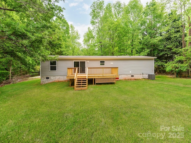 rear view of property with a lawn, central AC unit, crawl space, and a deck