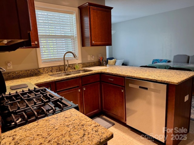 kitchen with light stone counters, stainless steel dishwasher, a sink, a peninsula, and open floor plan