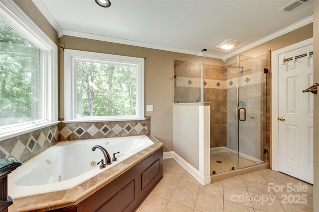 bathroom with tile patterned floors, a tub with jets, visible vents, ornamental molding, and a stall shower