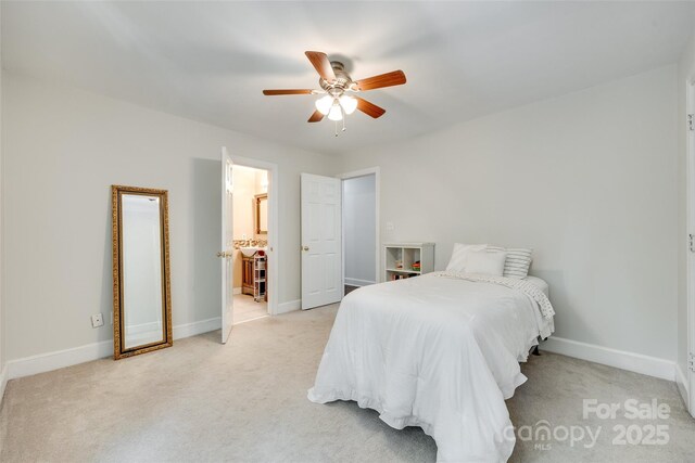 bedroom with baseboards, ceiling fan, and light carpet