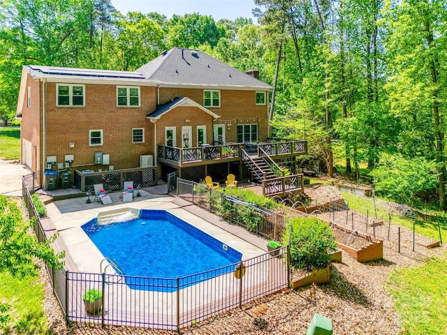7122 Forest Ridge Rd, Matthews, NC 28104 - view of swimming pool featuring a wooden deck, a vegetable garden, a fenced in pool, fence, and cooling unit