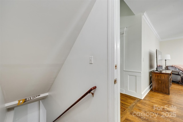7122 Forest Ridge Rd, Matthews, NC 28104 - staircase with crown molding and wood finished floors