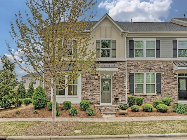 12641 Glowing Peak Rd, Huntersville, NC 28078 - view of front facade with board and batten siding, roof with shingles, and stone siding