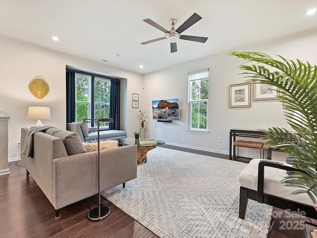 12641 Glowing Peak Rd, Huntersville, NC 28078 - living room featuring baseboards, ceiling fan, dark wood-style floors, and a healthy amount of sunlight