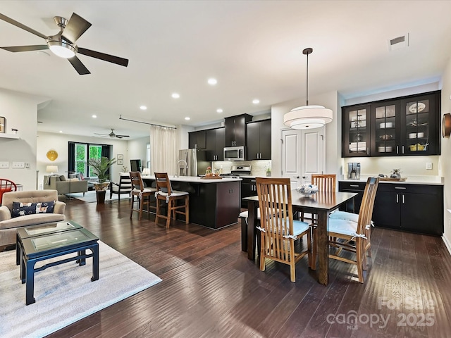 12641 Glowing Peak Rd, Huntersville, NC 28078 - dining space featuring recessed lighting, ceiling fan, visible vents, and dark wood-style floors