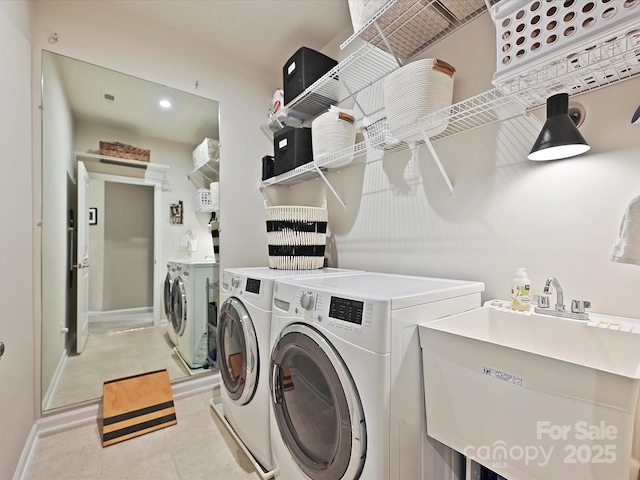 12641 Glowing Peak Rd, Huntersville, NC 28078 - laundry room featuring laundry area, a sink, baseboards, and washer and dryer