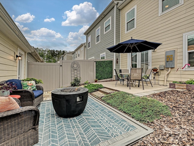 12641 Glowing Peak Rd, Huntersville, NC 28078 - view of patio with a gate, a fire pit, and fence