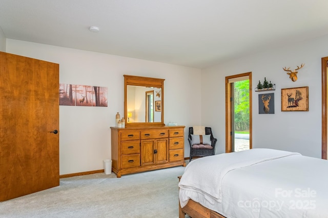 bedroom with baseboards, light carpet, and access to exterior